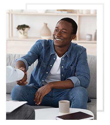 Male patient and male doctor discussing gynecomastia surgical solutions.