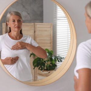 woman examining her breast