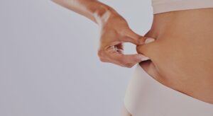 Someone pinching their waist