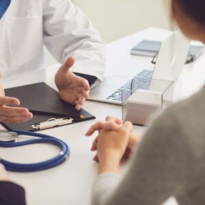 A woman talking with her doctor