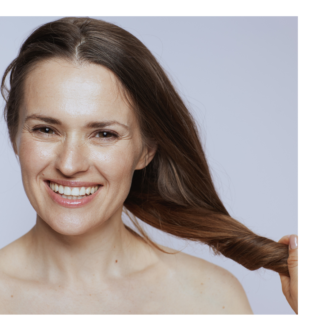 Woman smiling holding her hair